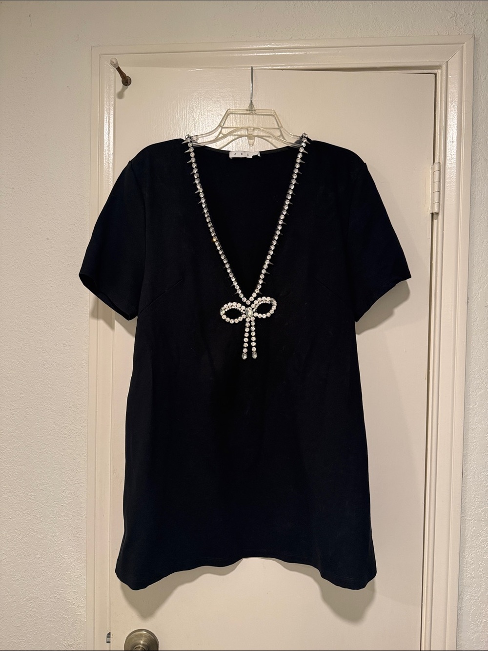 AREA Black Mini Dress with Rhinestone Bow Necklace Detail